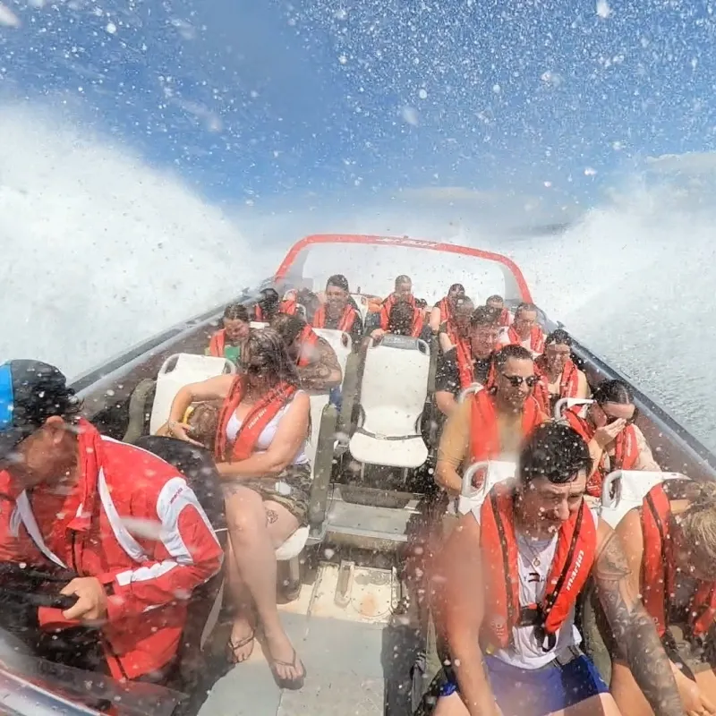 a group of people riding skis on a body of water