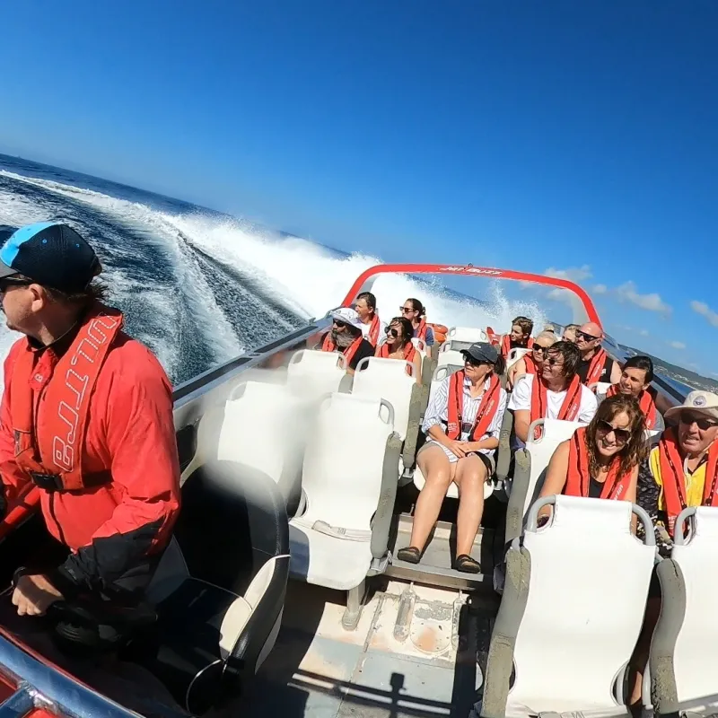 a man standing on a boat in the water