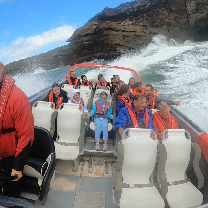 a group of people on a boat in the water