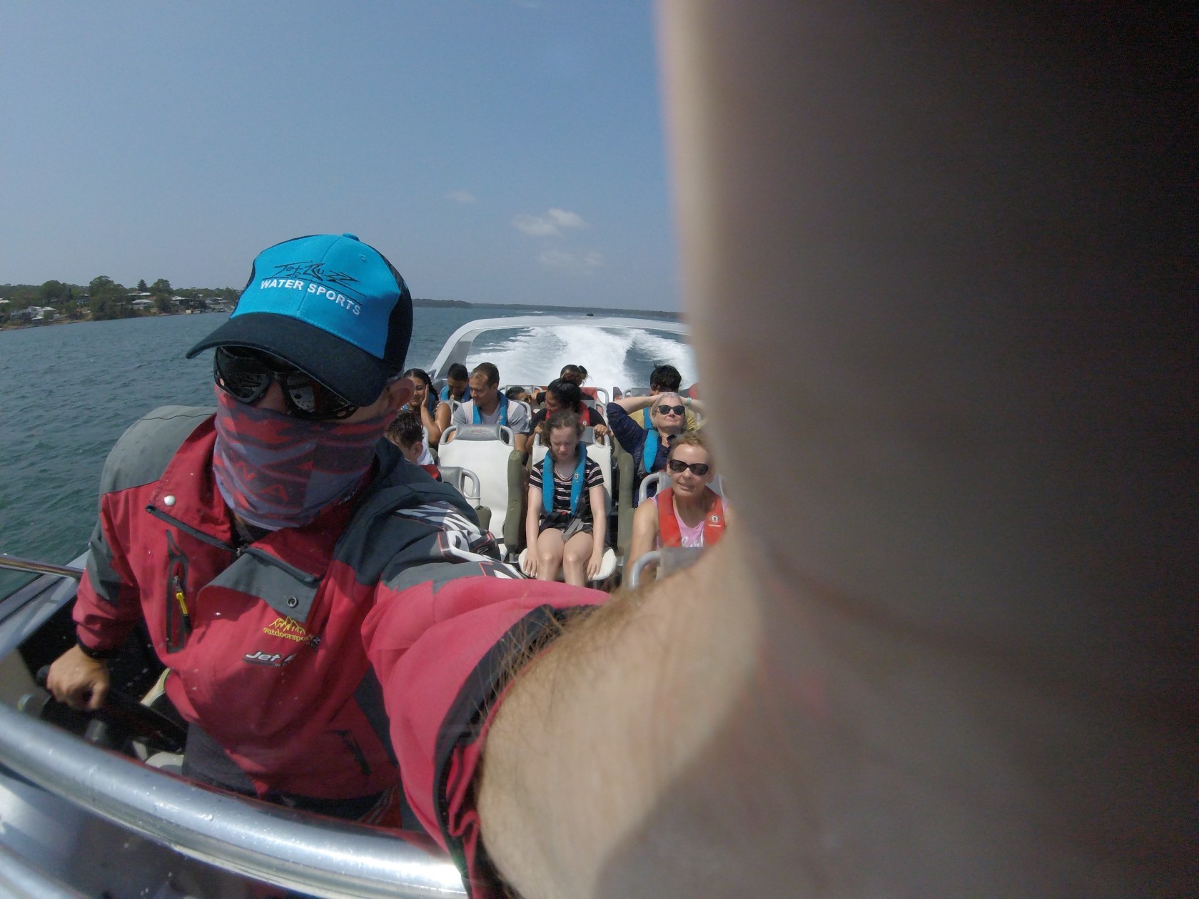 a group of people riding on the back of a boat